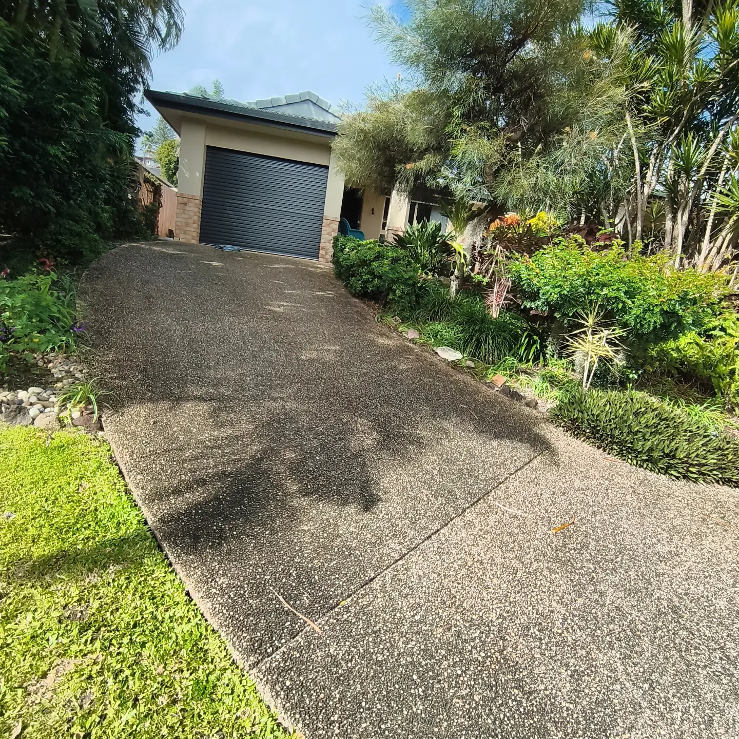 Driveway part way through a pressure clean